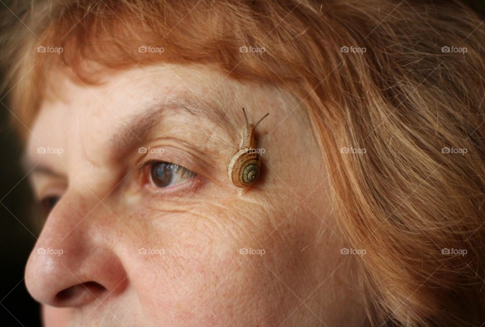 Portrait of a woman and snail