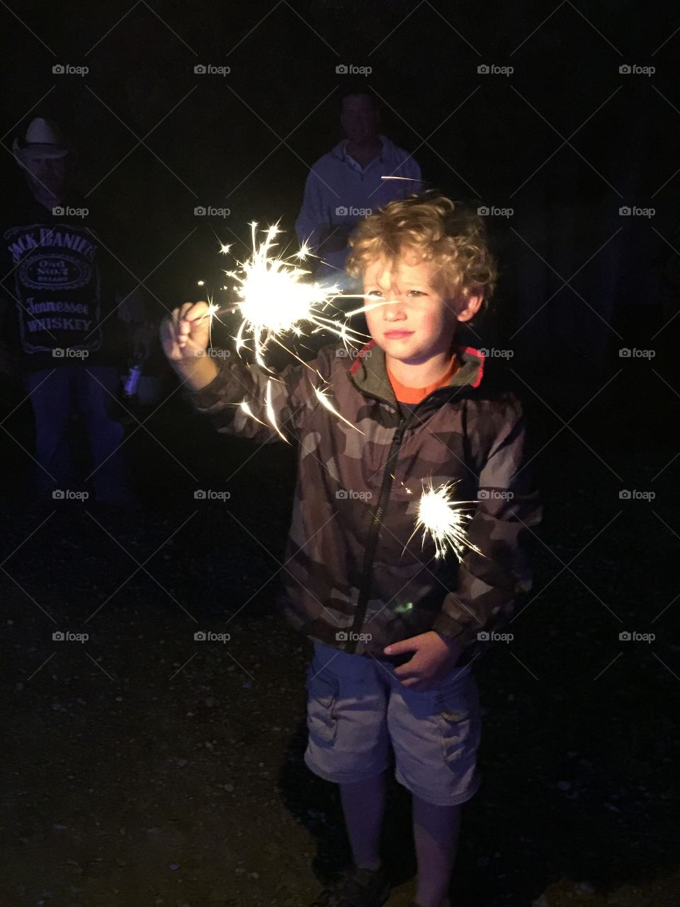 Boy holding sparkler