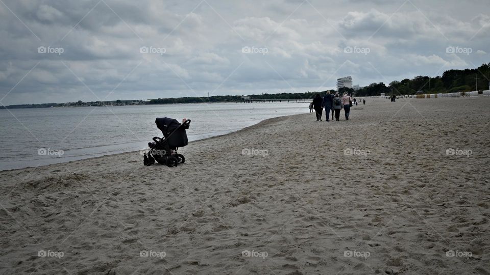 overlooking the sea the child in the stroller