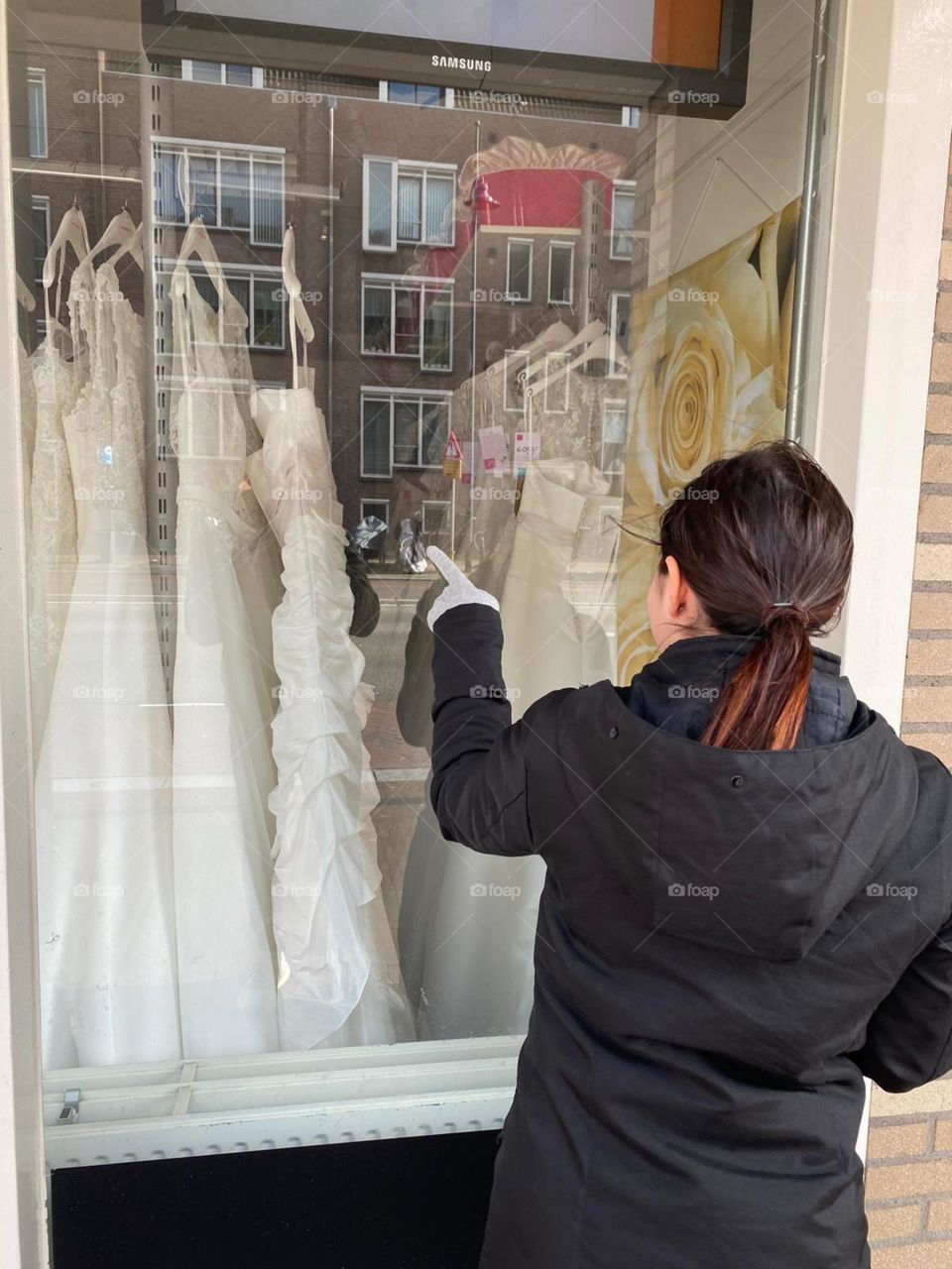 bride to be windowshopping dresses