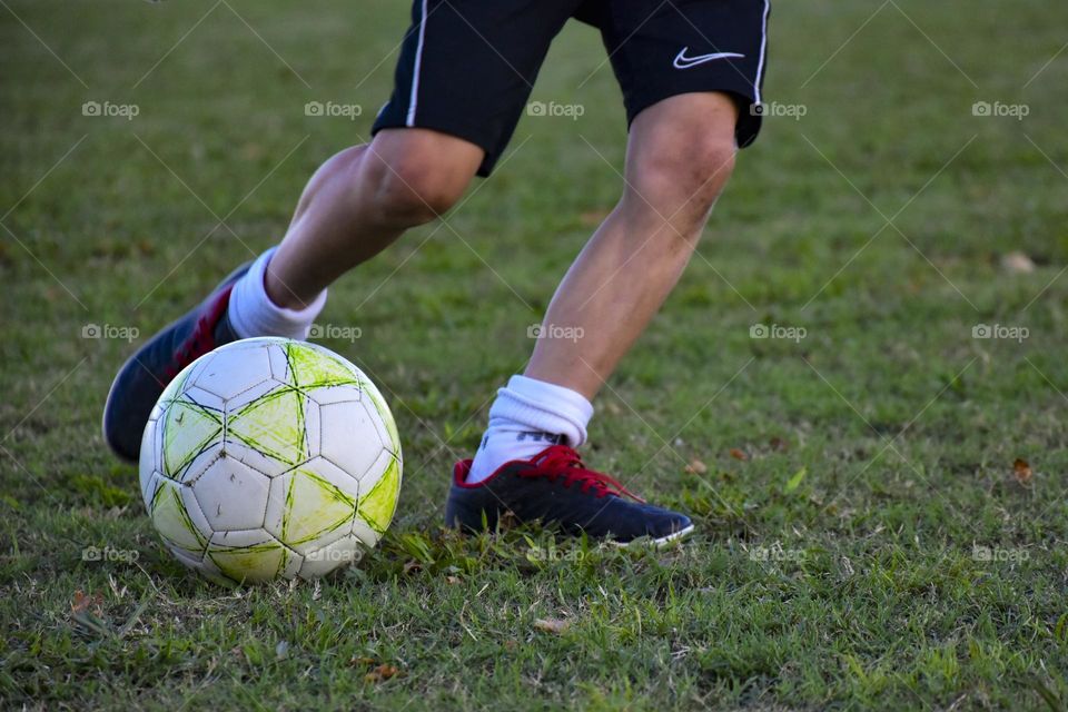 boy playing soccer