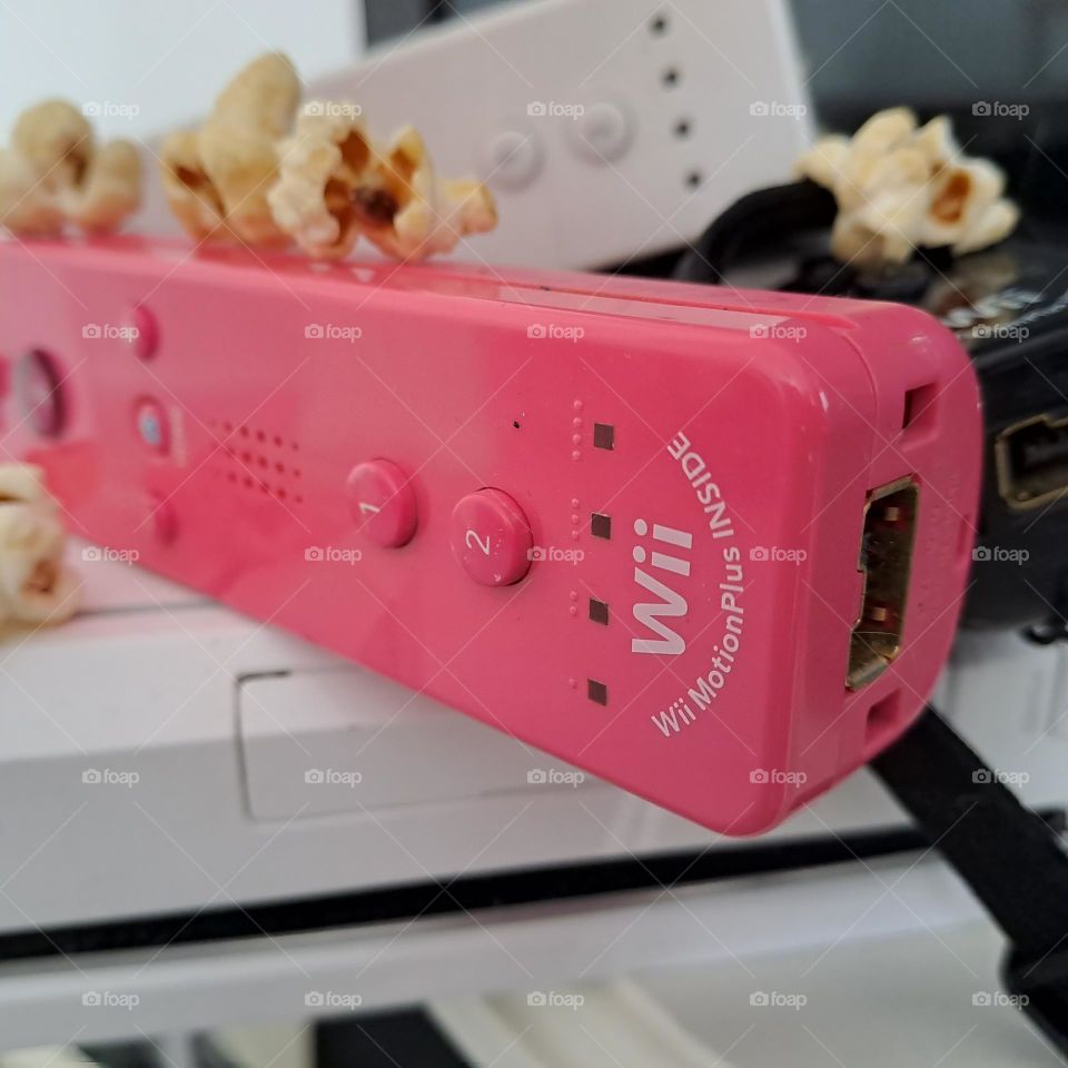 Wifi gaming controls pink white black. popcorn