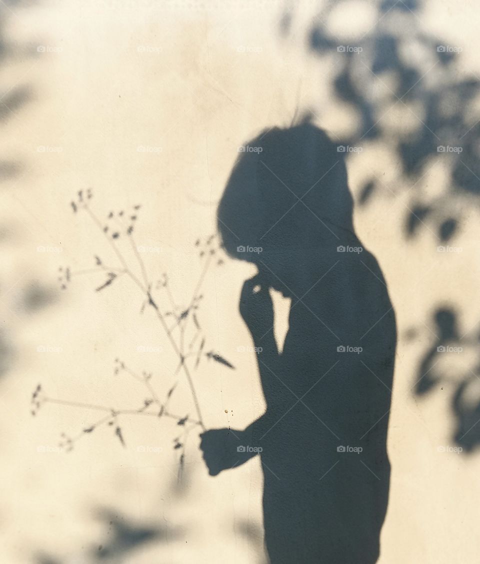 boy's shadow on the wall