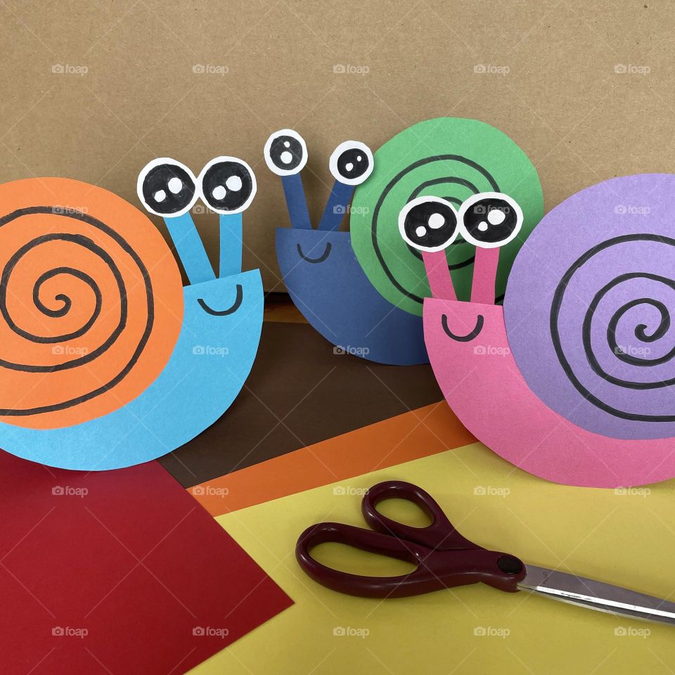 Snails in colored papers...