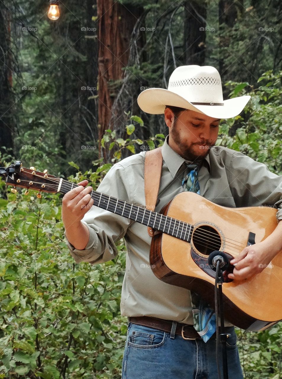 Country Music. Man In Cowboy Hat Playing Acoustic Guitar
