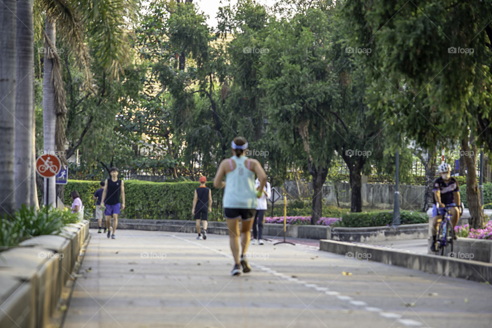 Blurry image people running exercise for health in the Benjakitti Park , Bangkok in Thailand.