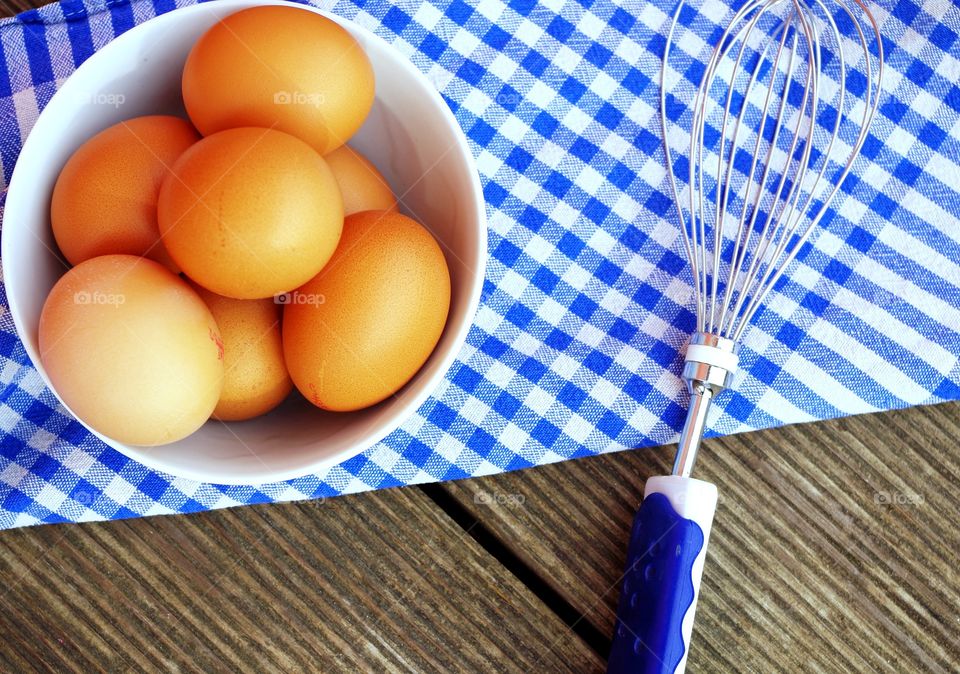 Eggs ands whisker on table