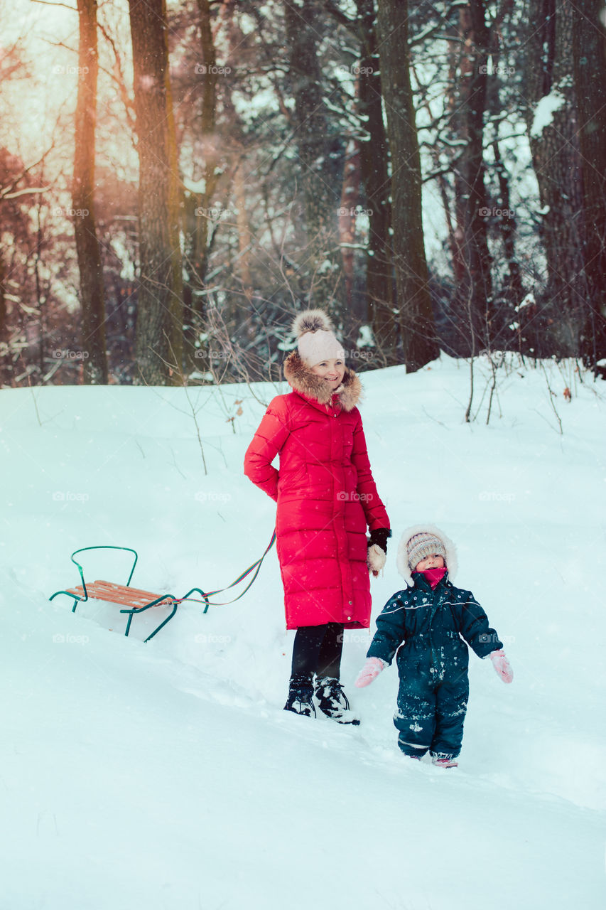 Winter with friends. Spending wintertime outdoors playing with snow