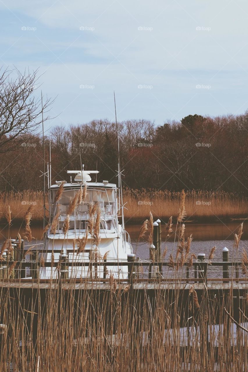 Boat docked at seaside, boat docked in New York, boat on the water, seaside with a boat 