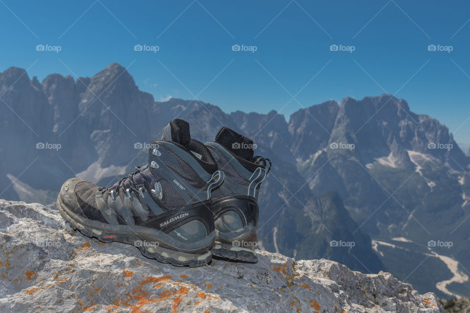 Hiking boots at the top of Cima del Cacciatore (2.071 m), Julian Alps, Italy
