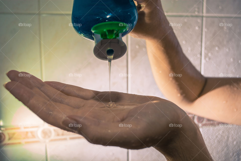 Pouring shampoo in the shower