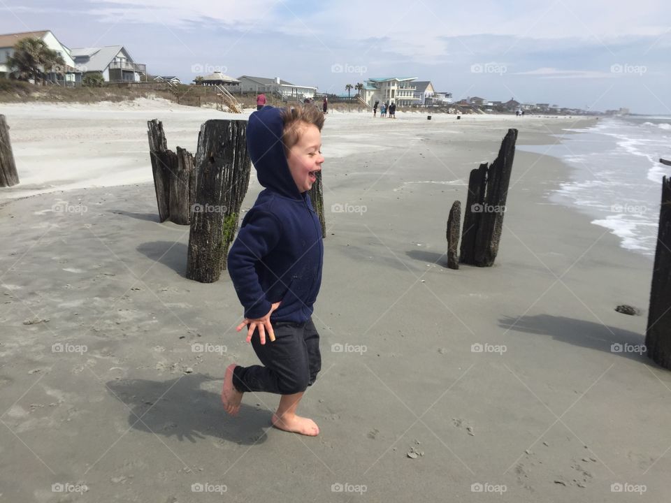 Child running on the beach