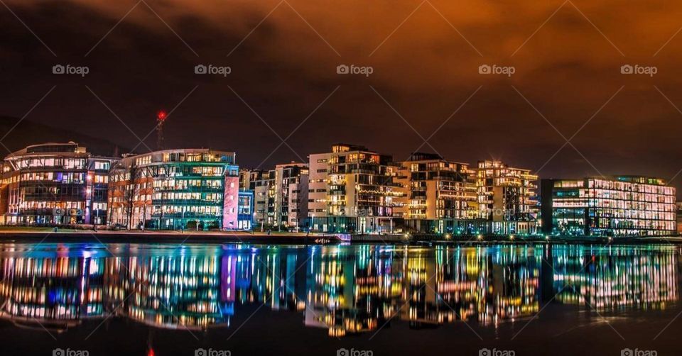 Golden lights glow against the dark, illuminating the beauty and charm of a city at rest