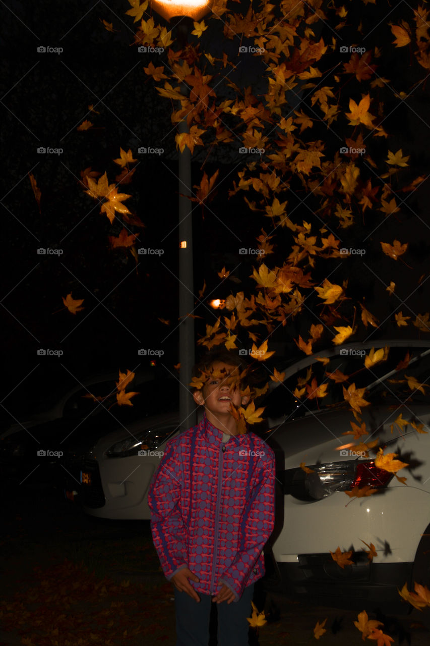 Little girl throws Leafs up in the air