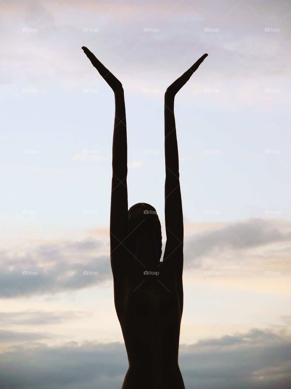 Silhouette of statue against sky