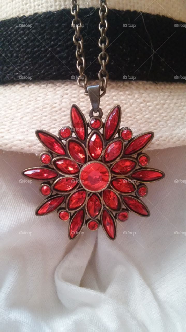 Red and Bold. Nature is my inspiration! This shiny and bold red flower pendant will make you and your outfits standout.