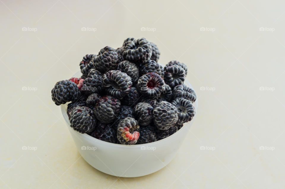 Black Raspberries In White Dish