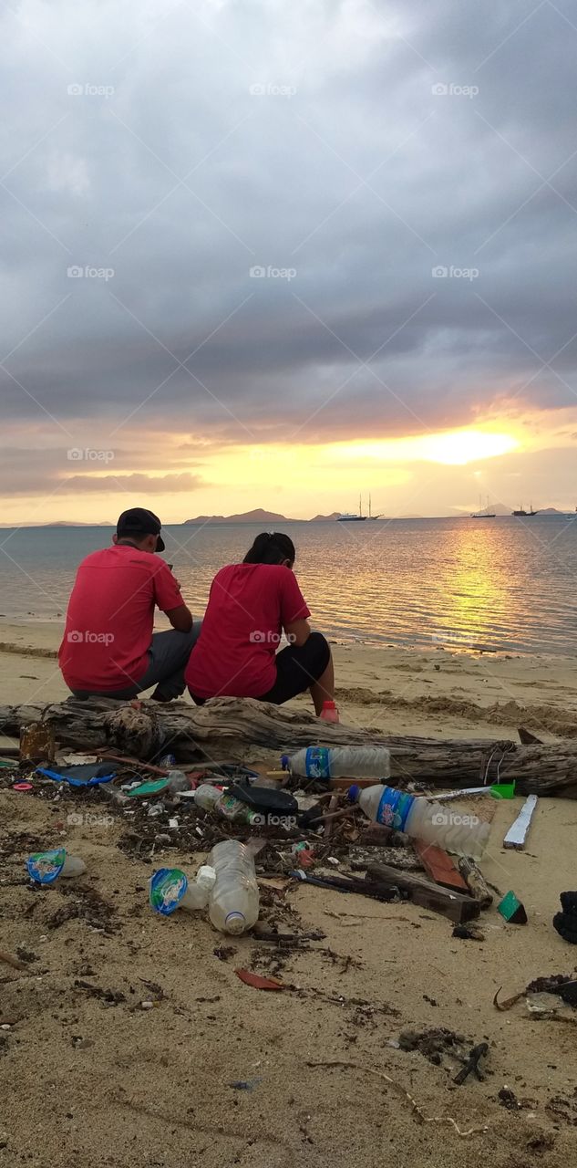 enjoying sunset with you and lot of trash