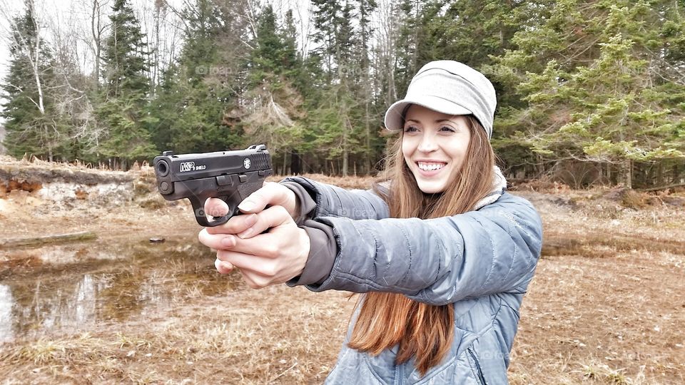 woman shoots pistol