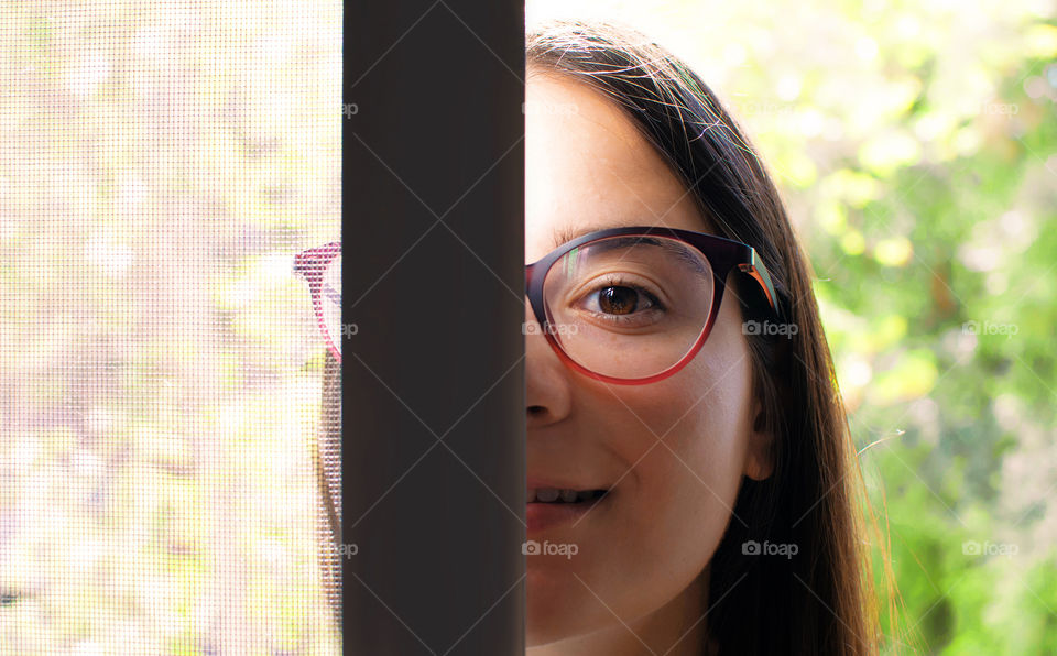 Portrait of smiling woman at her balcony  during quarantine