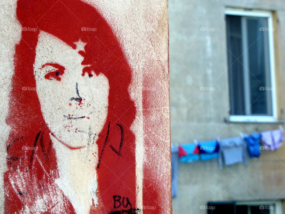 red woman figure on a wall