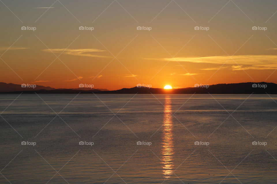 Sunset over calm ocean