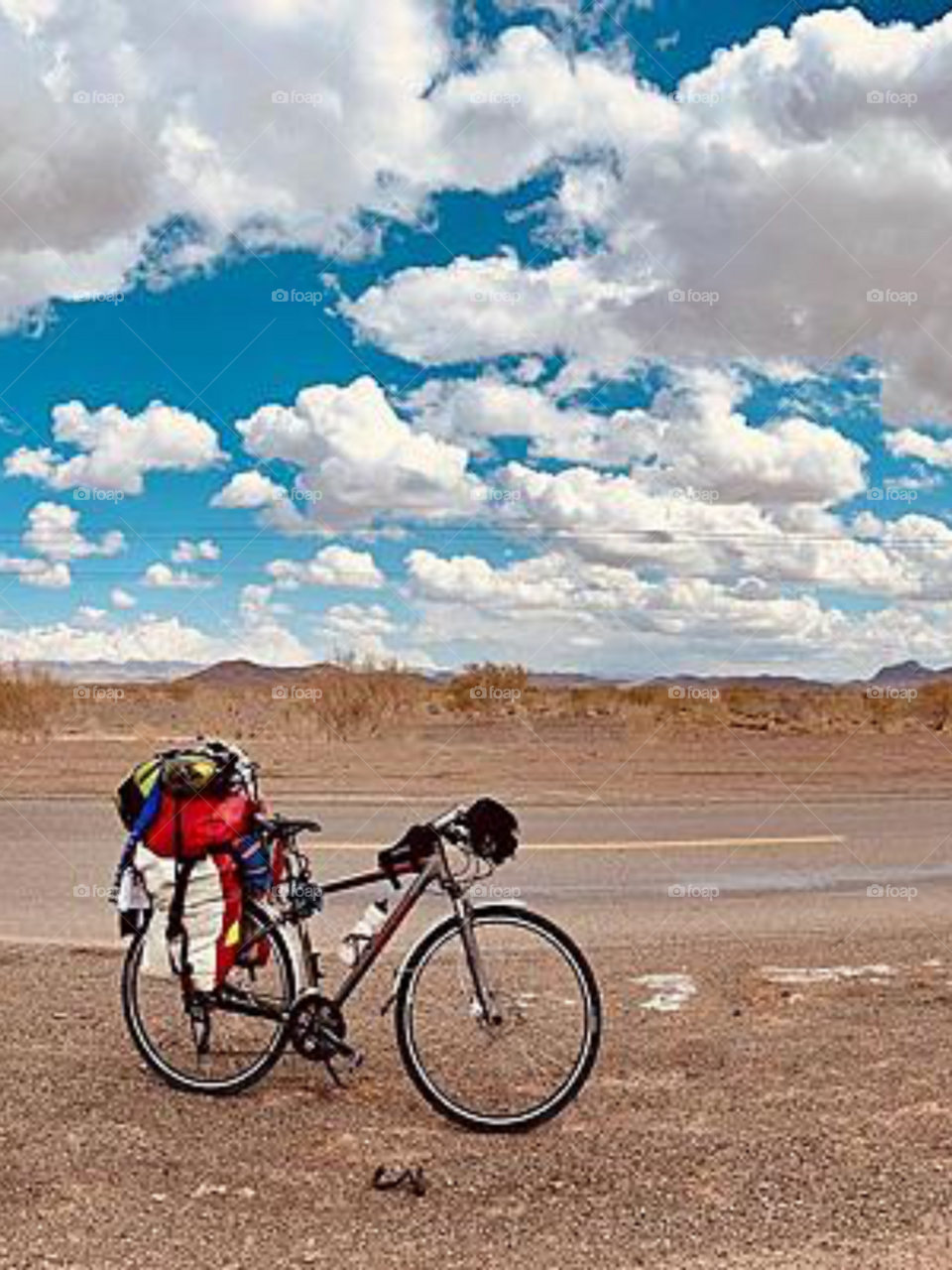 A lonely bicycle waiting in a desert for a ride