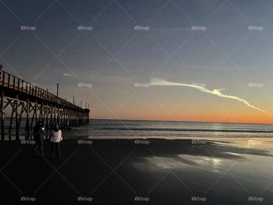 Rocket Soaring over Pier