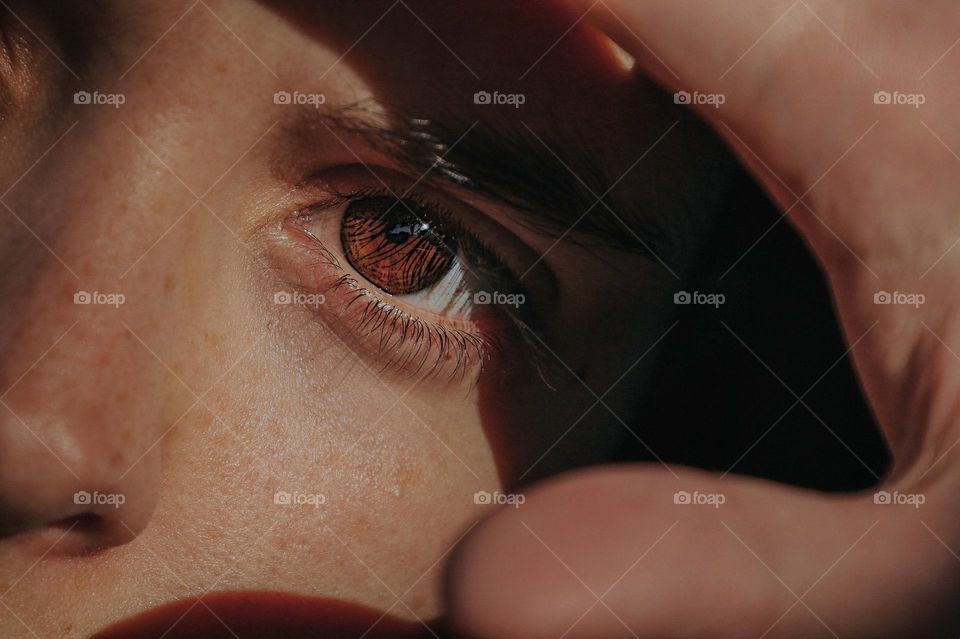 Close up of a human eye with a shadow 