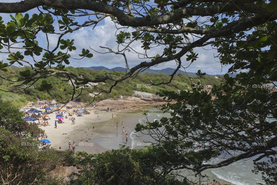 Tourists enjoy the summer on the little beach in Barra da Lagoa in Florianopolis Santa Catarina Brazil.