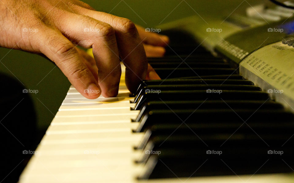 Artist playing keyboard, playing piano, music