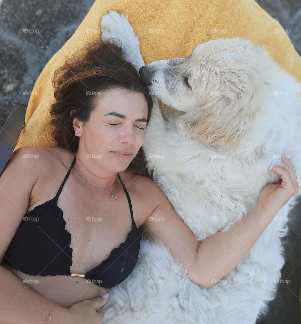 Sharing a beach chair for a good nap.