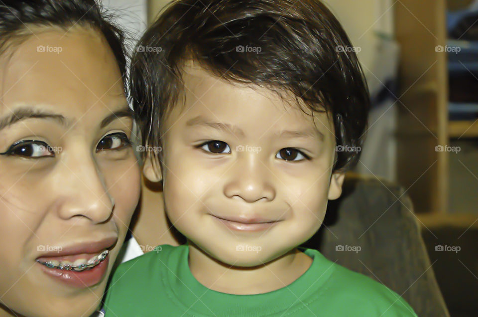 Portrait of mother and son are smiling happily.