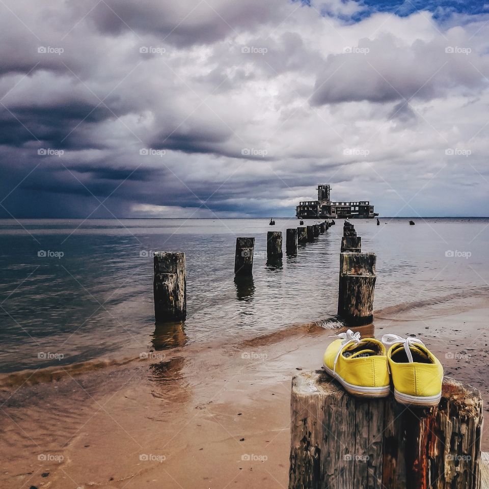 Scenic view of sea against cloudy sky