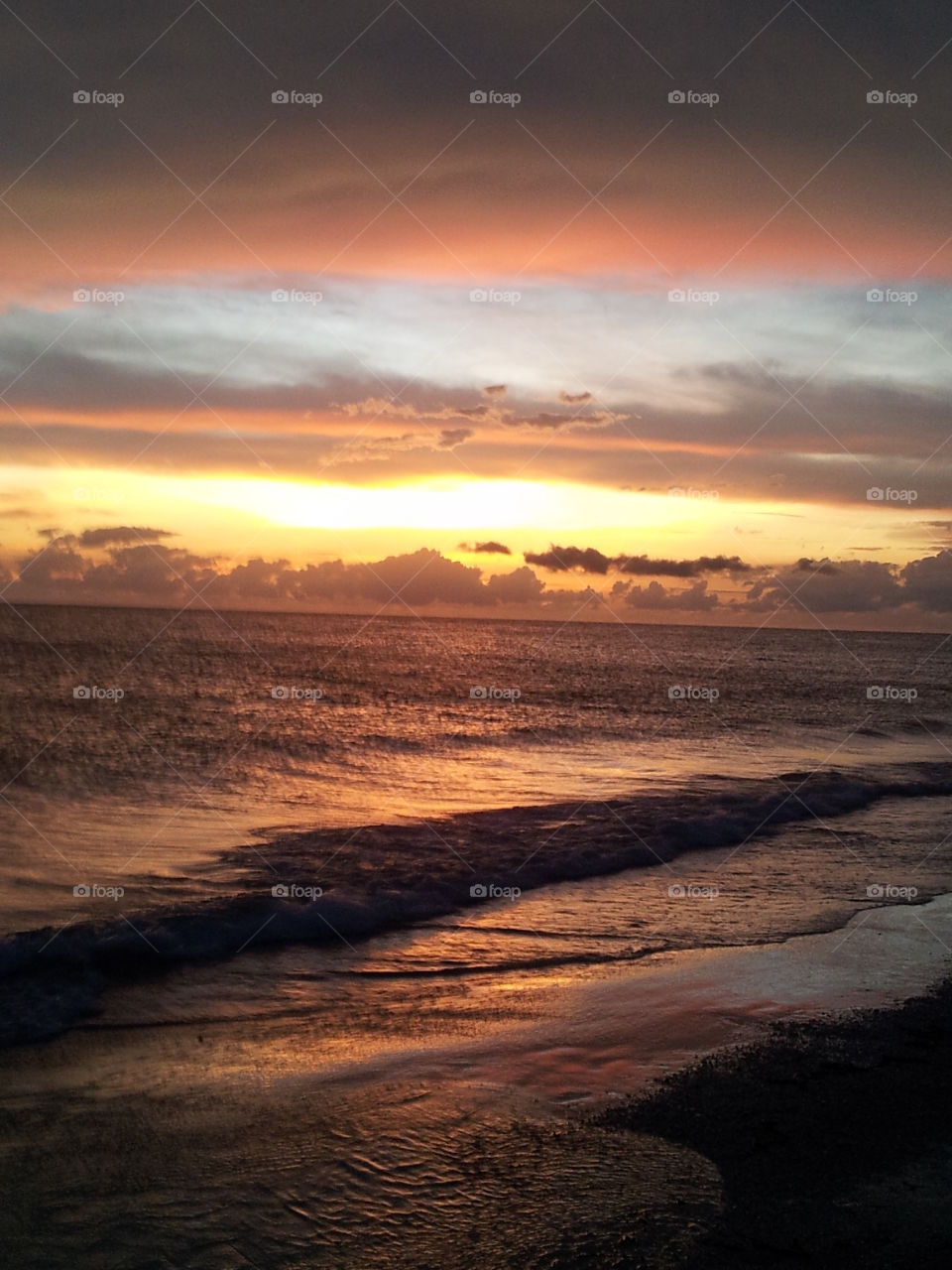 Sunset on the ocean. Sunset on Daytona beach at high tide.
