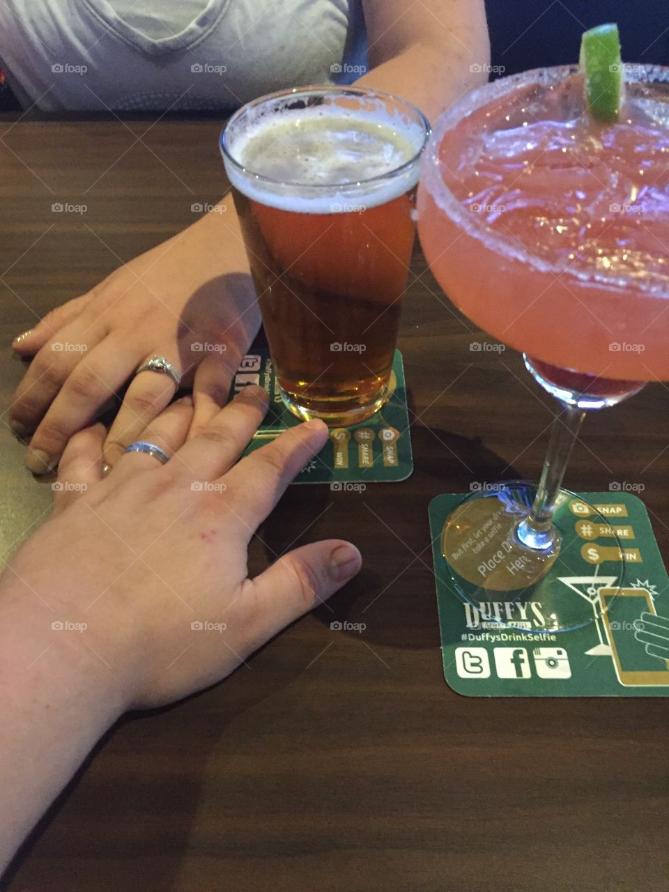 Just married having a drink at our favorite sports bar