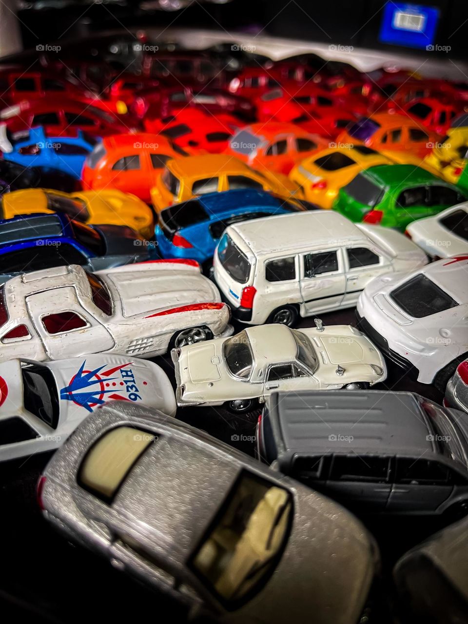 Colourful mini toy cars in colour coding in close up view