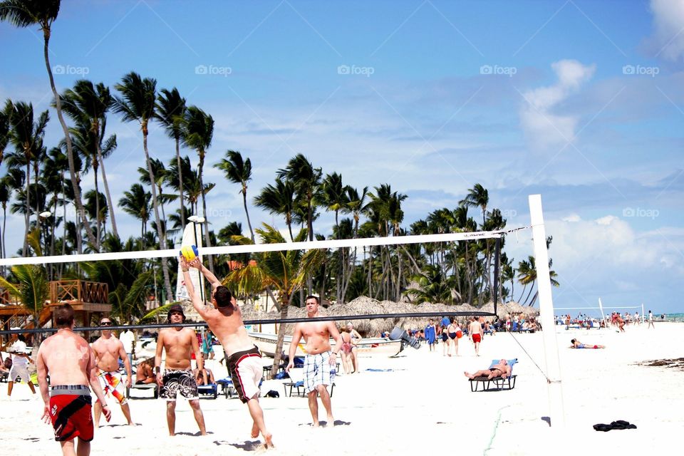 Action shot of beach volleyball 