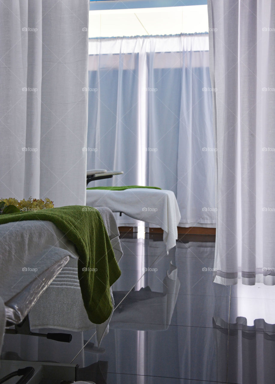 green details. beds in beauty clinic decorated with green elements
