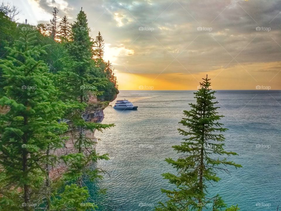 Sunset over pictured rocks tour catamaran