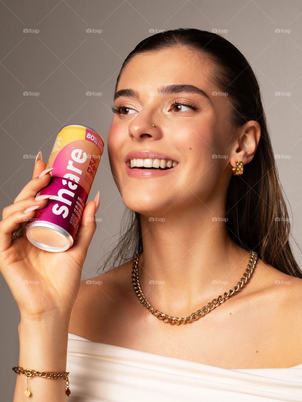 Portrait of a young woman with energy drink