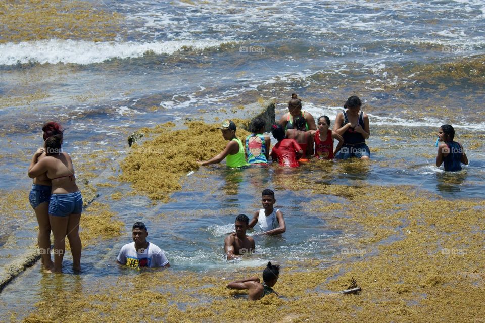 People Having Fun In The Sea
