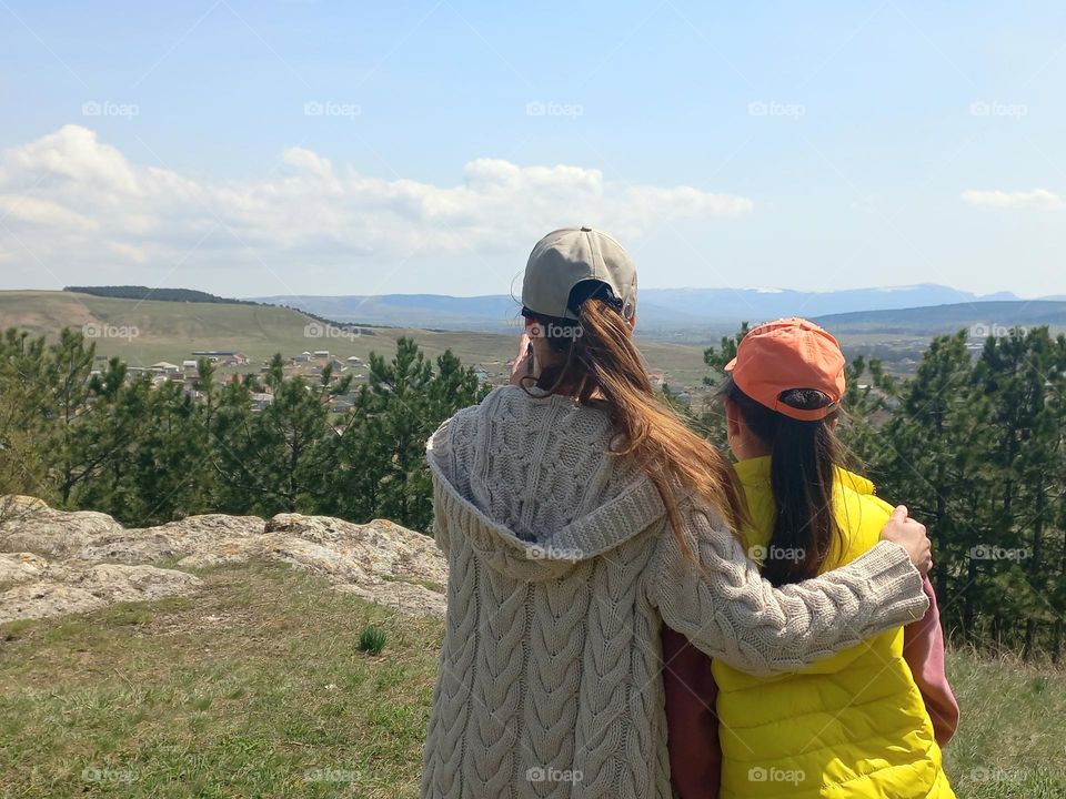 two girls looking at nature.