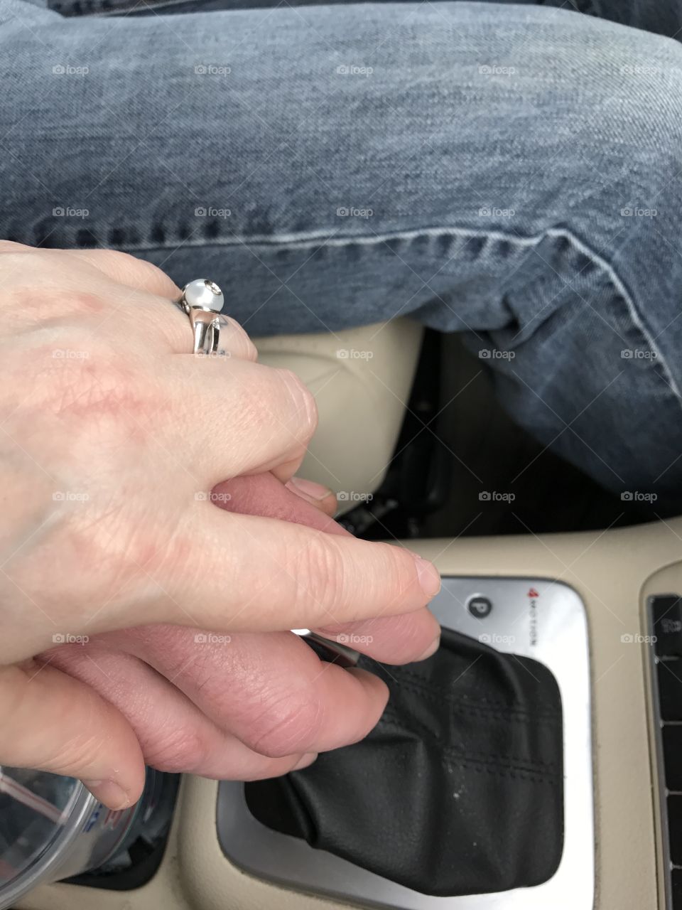 Holding hands and driving