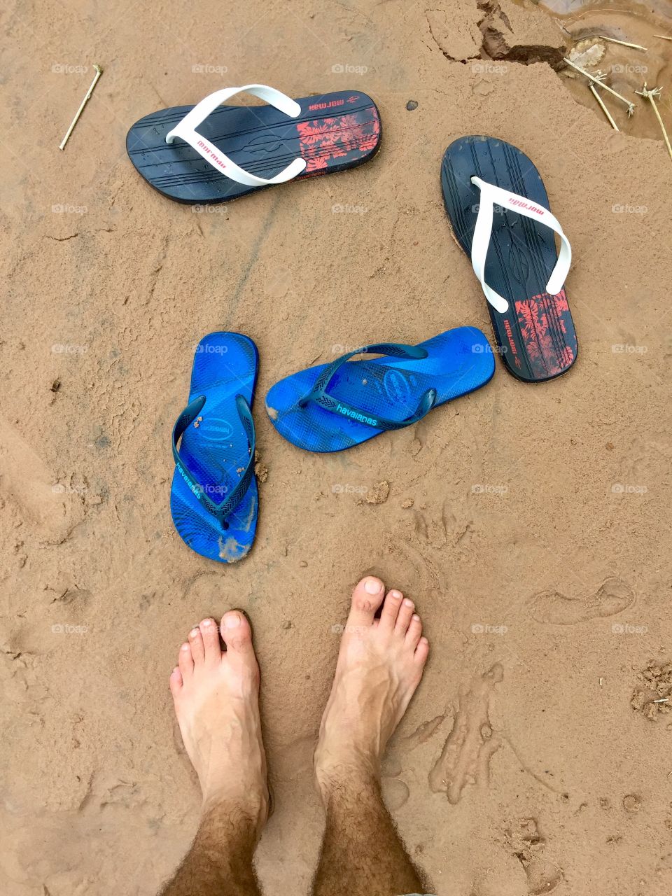 feet on the sand. 