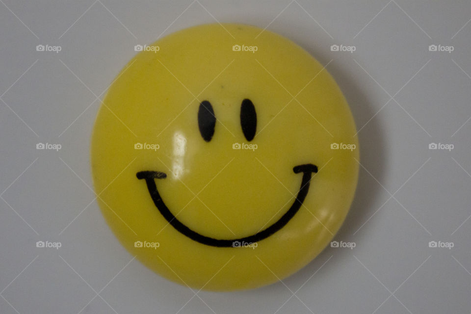 Yellow happy face magnet