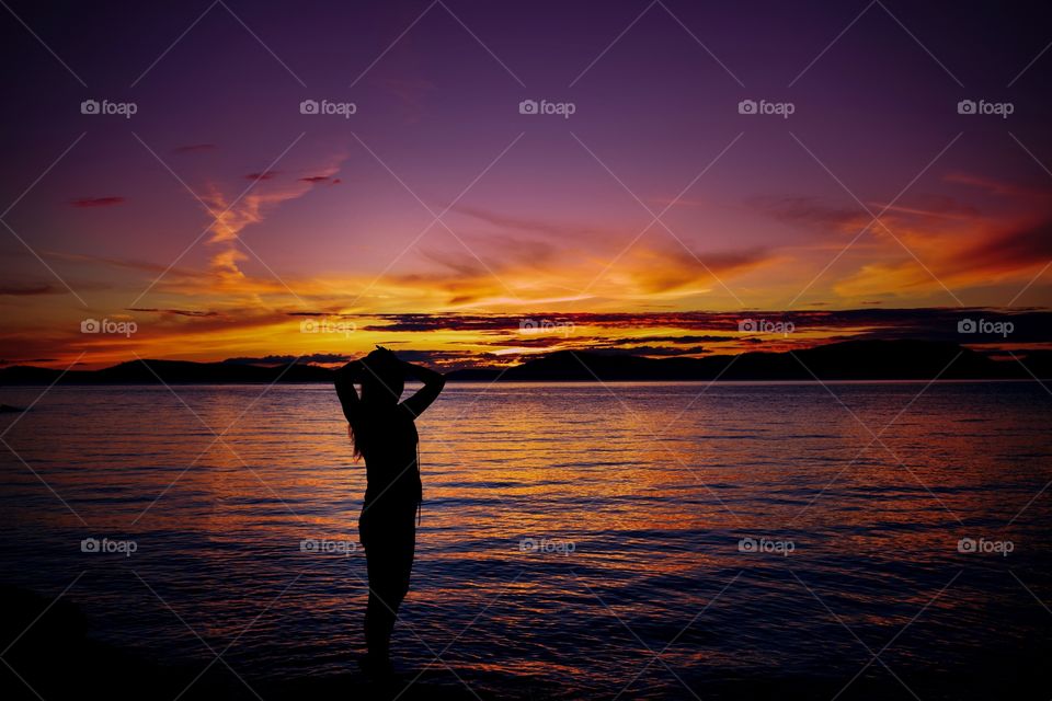 Silhouette of woman posing at beach