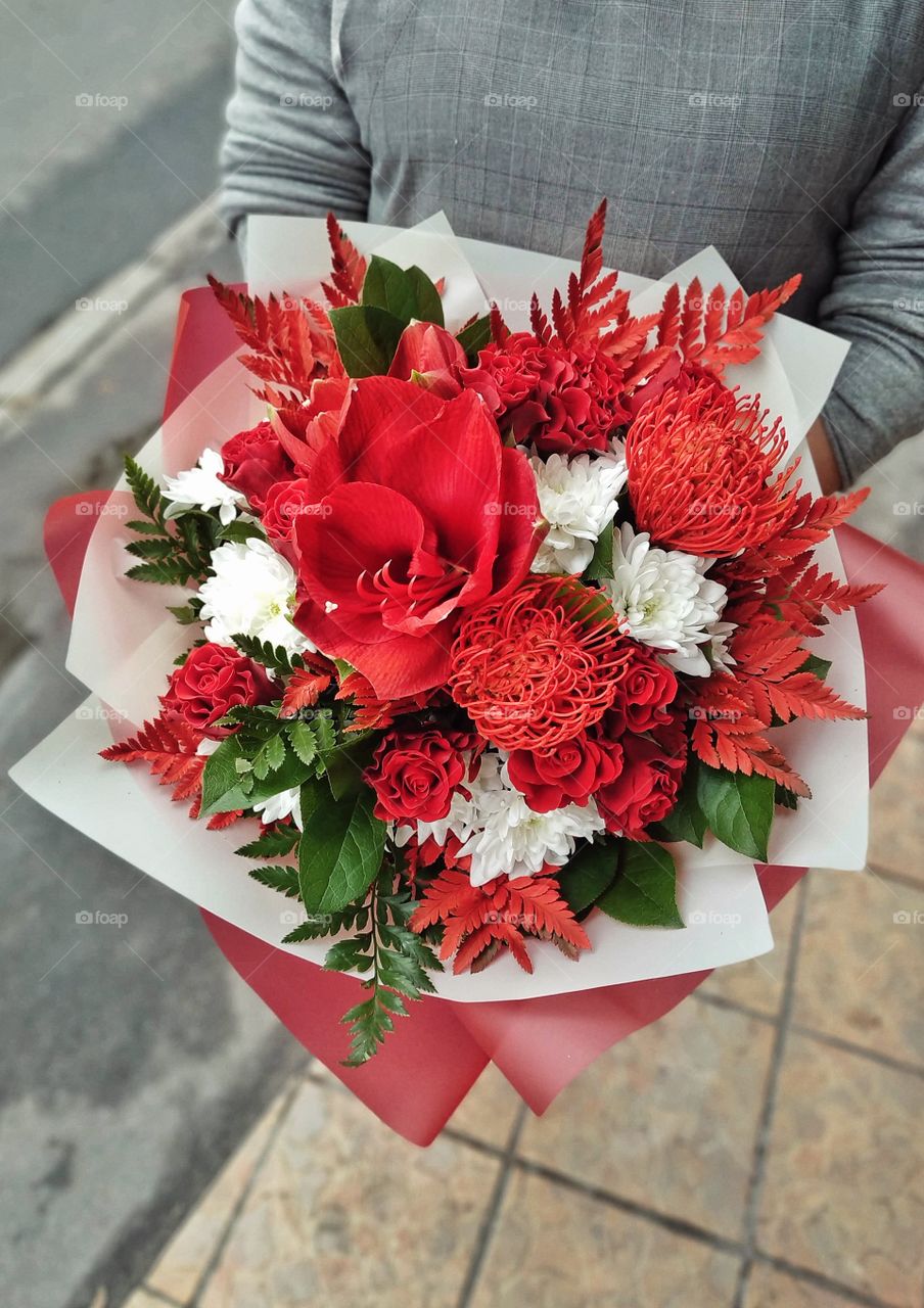 beautiful autumn bouquet in red with exotic and rare flowers