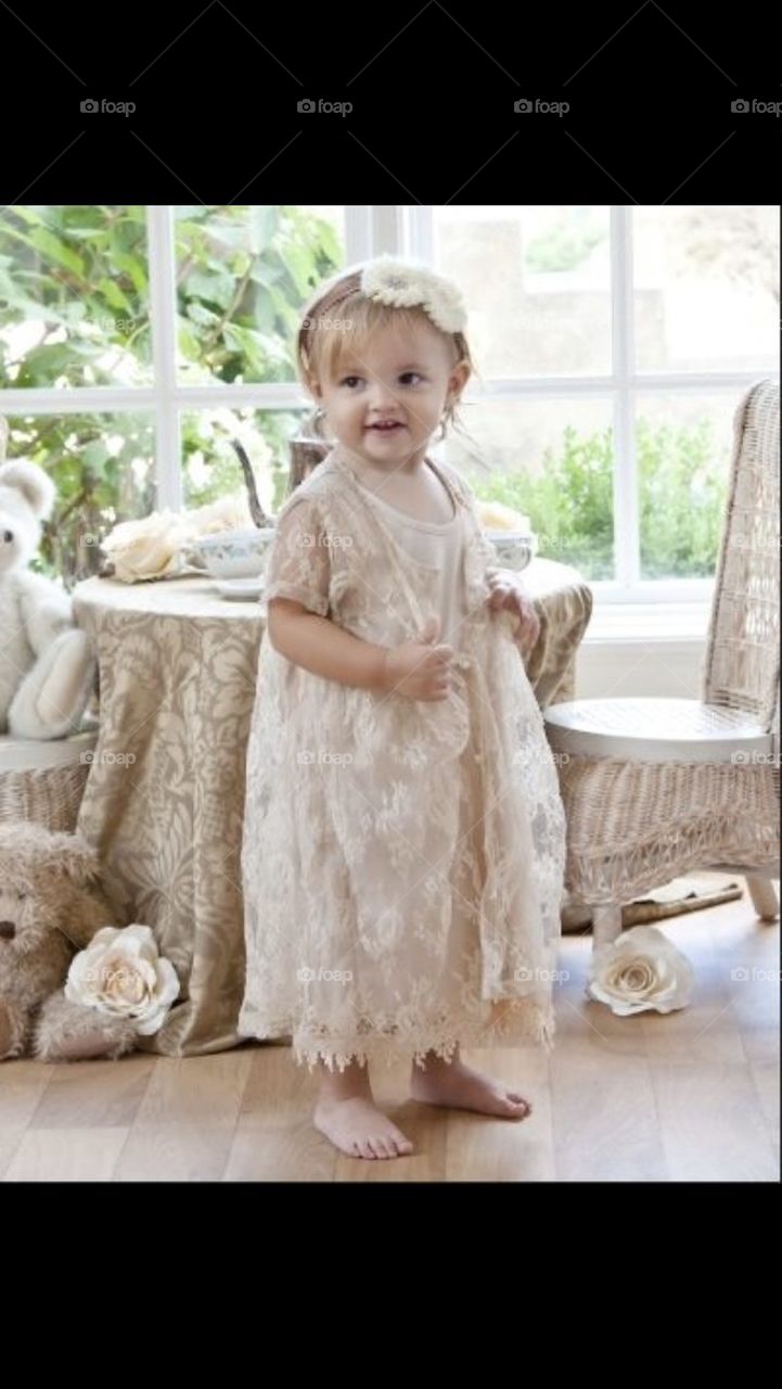 Little Girl in Vintage Lace Dress playing Tea Party