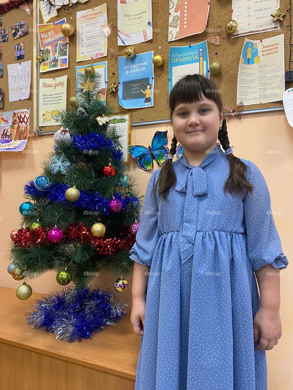 girl next to the Christmas tree